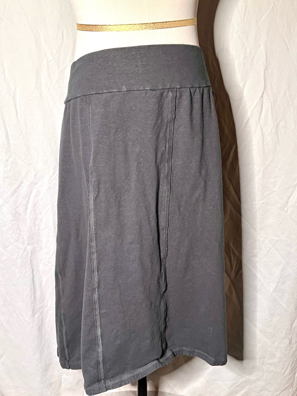 Intertwined Designs is a hand-crafted, organic gray skirt.